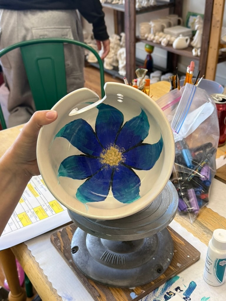 Hand-painted ceramic bowl with blue pressed flower