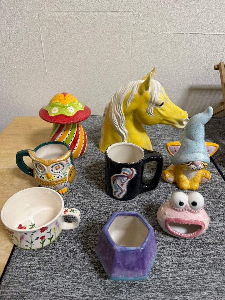 Colorful ceramic figurines and novelty vessels